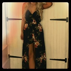 Black floral dress/romper. Built in shorts. Deep V